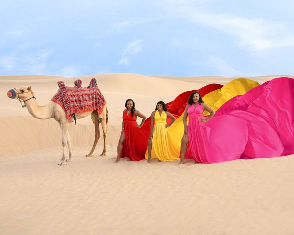 Friends posing together outdoors on a group trip