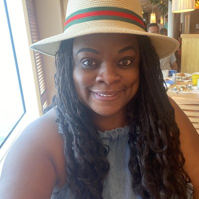 Toni Banks wearing hat at a restaurant